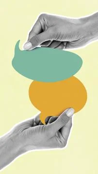 Hands hold colored speech bubbles with messages on a light green background Stock Photos
