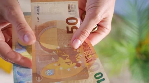 Hands hold different euro banknotes and euro coins. State aid in times of crisis Video stock 197696780