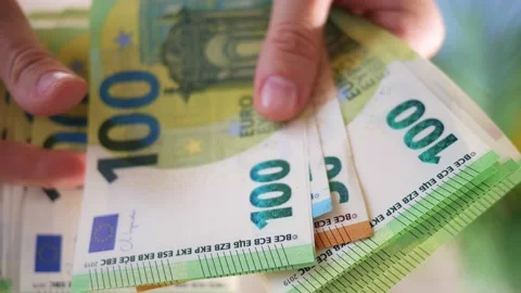 Hands hold different euro banknotes. State aid in times of crisis to compensate 스톡 동영상 197700659