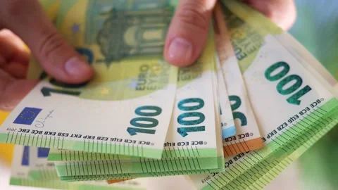 Hands hold different euro banknotes. State aid in times of crisis to compensate Stock Footage 208881633