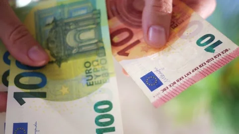 Hands hold different euro banknotes. State aid in times of crisis to compensate Stock Footage 210827723