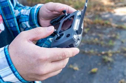 Hands hold the drone copter control close-up Foto stock