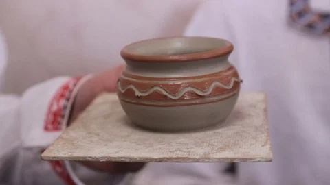Hands hold a pottery ceramics Stock Footage 73769279