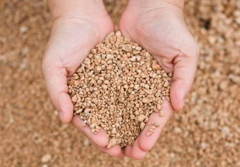 The hands hold small rocks Stock Photos