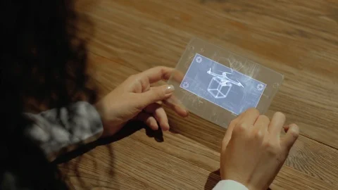 Hands hold tablet with delivery drone Stock Footage 116129377