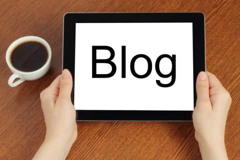 Hands hold tablet pc with blog word . Stock Photos