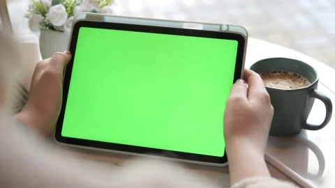 Hands hold tablet showing green screen Stock Footage 340900835