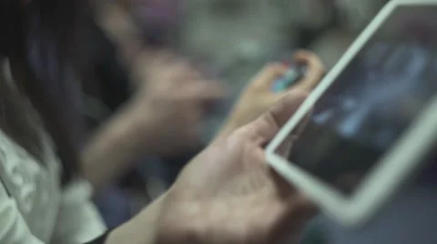 Hands Hold Tablets In City Metro Stock Footage 64897512