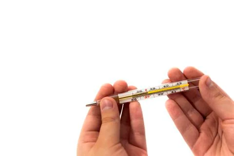 Hands hold a thermometer Stock Photos