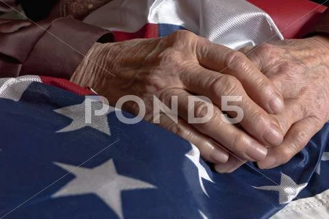 Hands holding an american flag Stock Photos