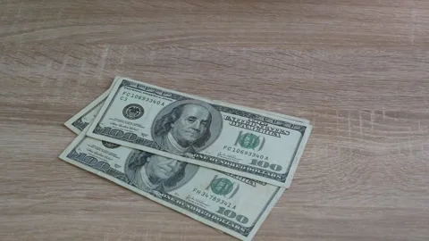 Hands holding and counting the big stack of dollar USA  money background. m.. Stockbeeldmateriaal 314395065