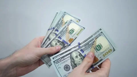 Hands holding and counting US dollar banknotes Stock Footage 283931695