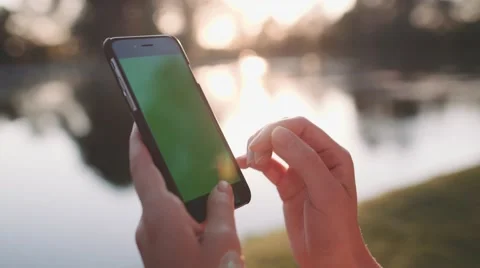 Hands holding and using business smartphone CHROMA KEY. SLOW MOTION 120 fps 4K. 動画素材 65405372