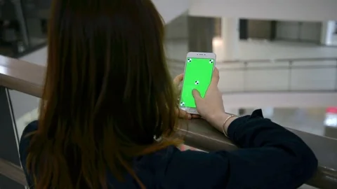 Hands holding and using business smartphone CHROME KEY. Fingers make gestures on Stock Footage 70274337