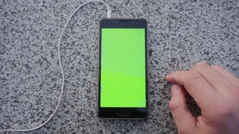 Hands holding and using business smartphone CHROME KEY. Fingers make gestures on Stock Footage 75688884