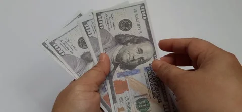 Hands holding assorted United States Dollar Bills Stock Footage 321024327