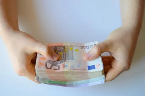 Hands Holding a Big Stack of Money Stock Photos