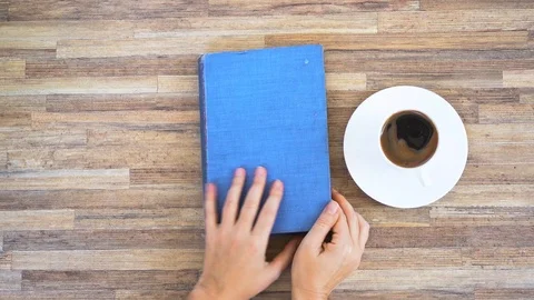 Hands holding book Stock Footage 112300055