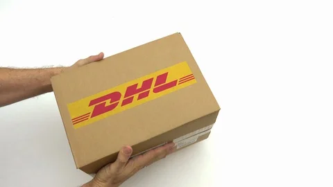 Hands holding box with DHL logo. Editorial clip Stock Footage 99575073