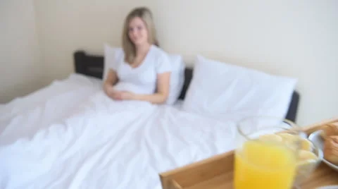 Hands holding breakfast tray for happy woman. Stock Footage 59223666