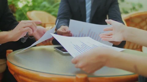 Hands holding the business documents during discussion at the meeting Stock Footage 57457866