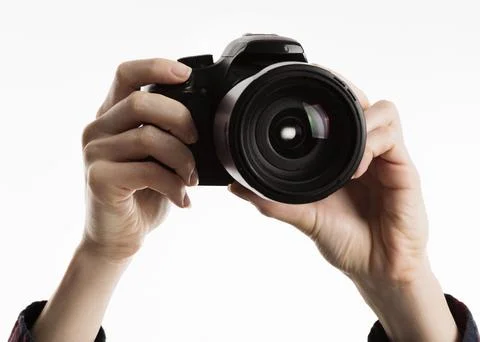 Hands holding camera. High quality beautiful photo concept 库存照片