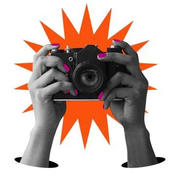 Hands holding a camera with a starburst background on a white backdrop. Stock Photos