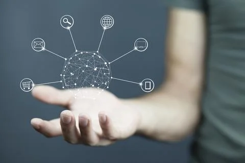 Hands holding circle global network connection in screen Stock Photos