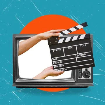 Hands holding a clapper while filming a video movie on TV. A clapper for a mo Stock Photos