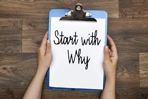 Hands holding a clipboard with start with why text  Stock Photos