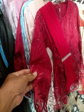 Hands holding clothes Stock Photos