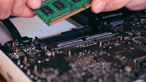 Hands holding computer RAM memory plate. Computer diagnostics concept. Laptop Stock Footage 157890856