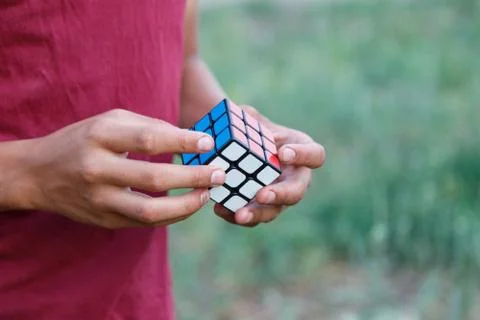 Hands holding cube of rubik Stock Photos