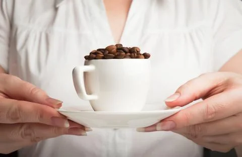 Hands holding a cup Stock Photos