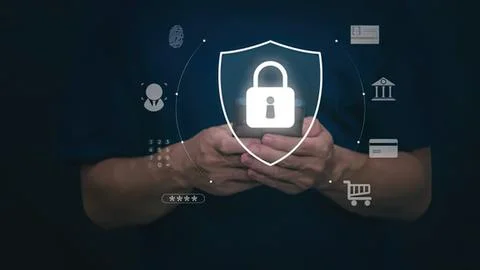 Hands holding digital lock shield with security icons Stock Photos