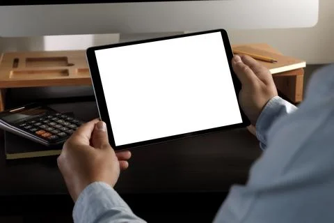 Hands holding digital Mock up tablet touch screen device isolated screen and  Stock Photos