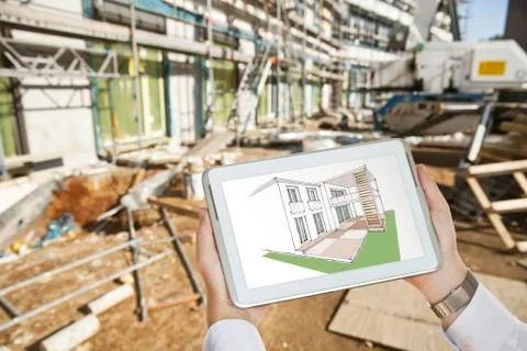 Hands holding a digital tablet with an architectural house sketch in front of a Fotos de archivo