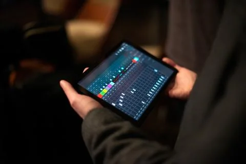 Hands holding digital tablet computer. Top view Stock Photos