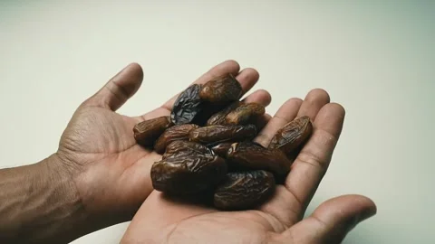 Hands Holding Dried Dates Footage, Hands holding a handful of dried dates a.. 스톡 동영상 304975014