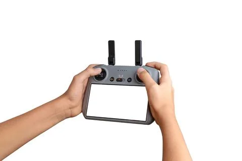 Hands holding a drone controller with empty screen, ideal for UI mockups, d.. Stock Photos