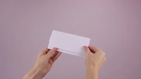 Hands holding envelope with empty card. Letter with copy space for advertisement Stock Footage 123163069