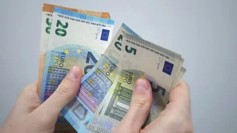 Hands holding euro banknotes in different denominations Stock Footage 287033296