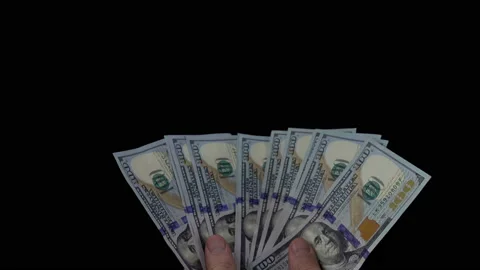 Hands holding a fan of dollar bills in 4K Stock Footage 155331908