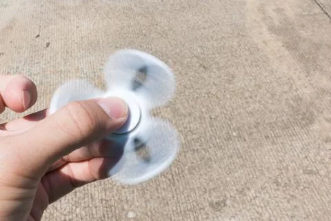 Hands holding  Fidget spinner Stock Photos