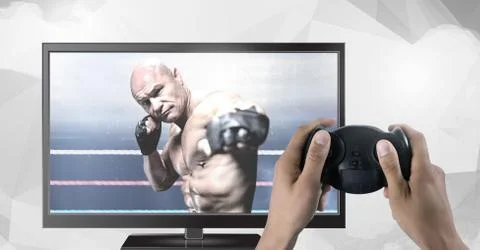 Hands holding gaming controller  with mixed martial arts fighter on television Stock Photos