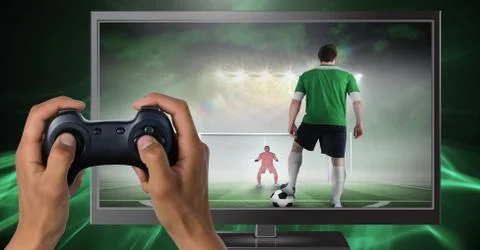 Hands holding gaming controller  with soccer player on television Stock Photos