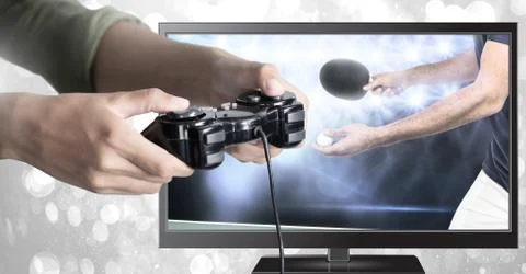 Hands holding gaming controller  with table tennis on television Stock Photos