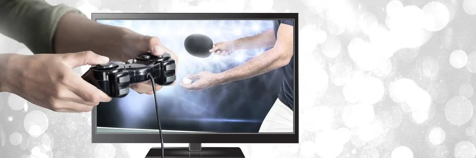 Hands holding gaming controller  with table tennis on television Stock Photos
