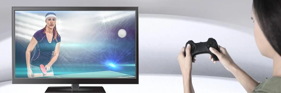Hands holding gaming controller  with table tennis player on television Stock Photos