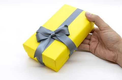 Hands holding  gift box with as a present for Christmas, new year, valentine Stock Photos